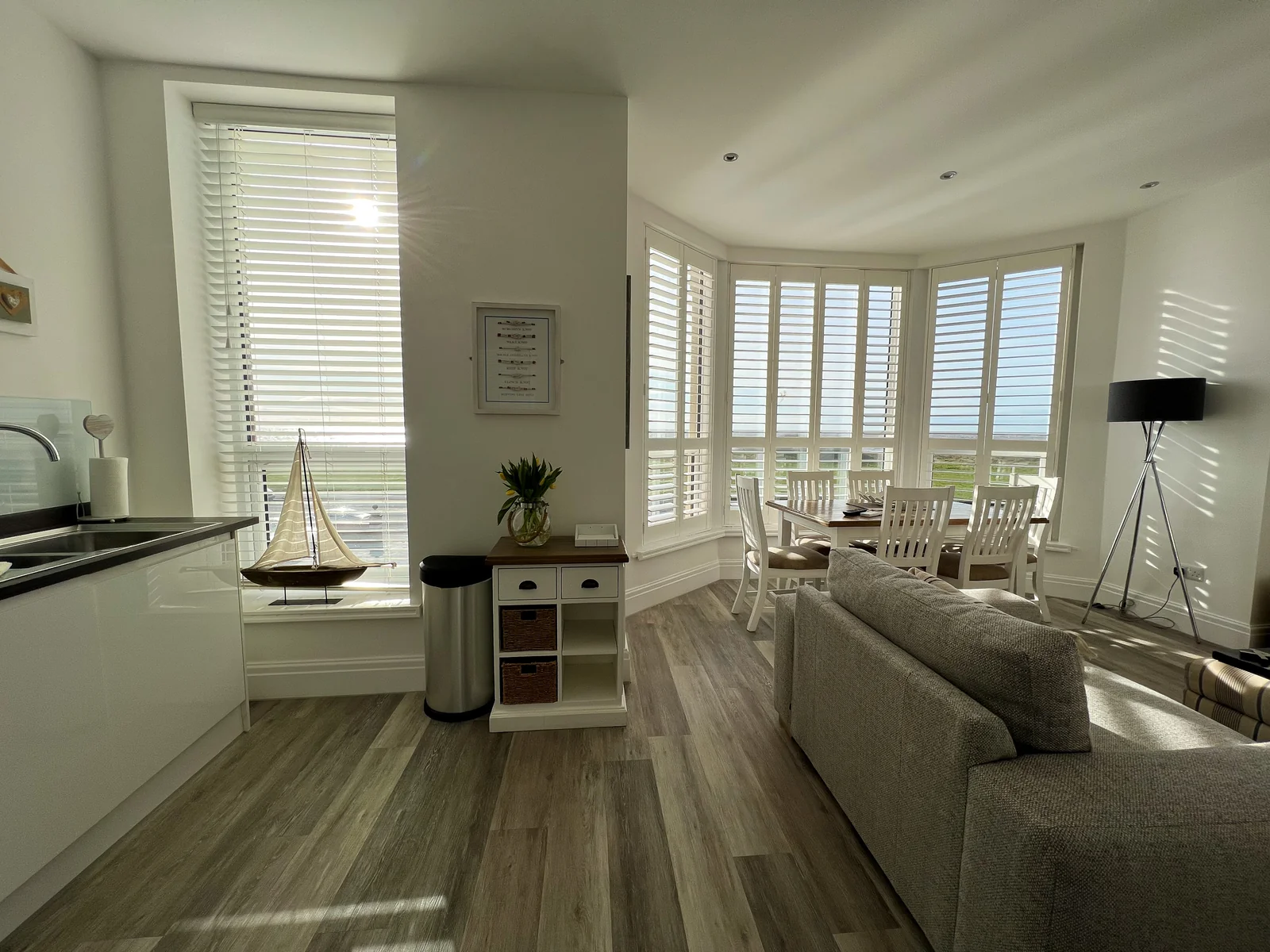 Open-plan living and dining area in Dunes Apartment