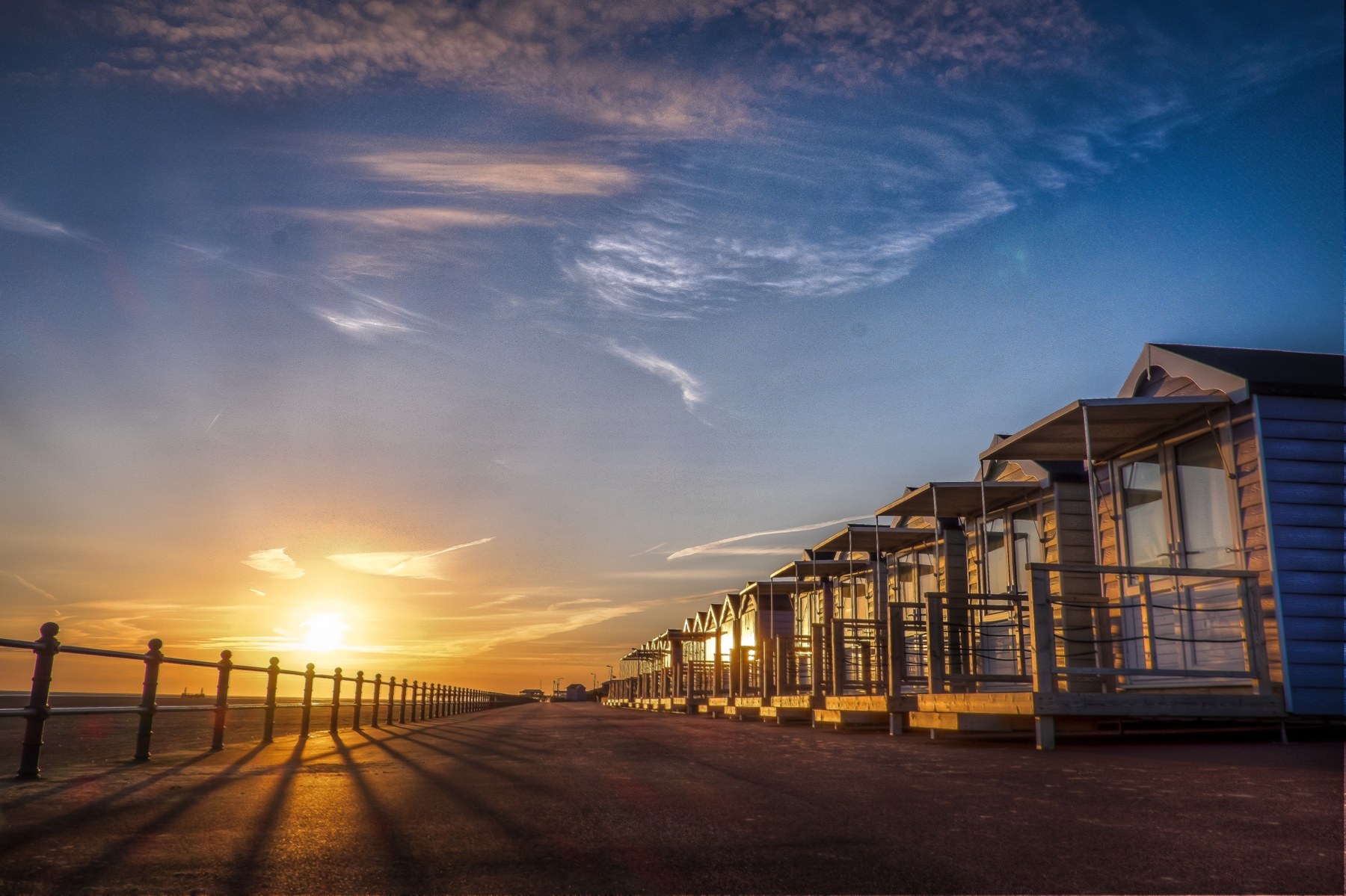Sunset along the Beach Huts and promenade at St Annes