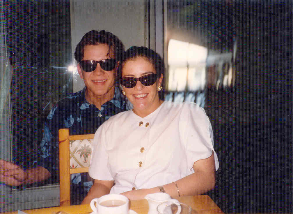Stuart and Zoe together in an older photograph, both wearing sunglasses.
