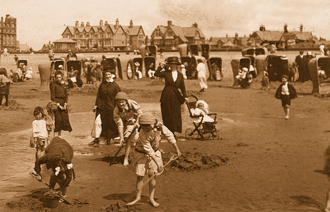 A historic view of the beach and bathing huts at St Annes