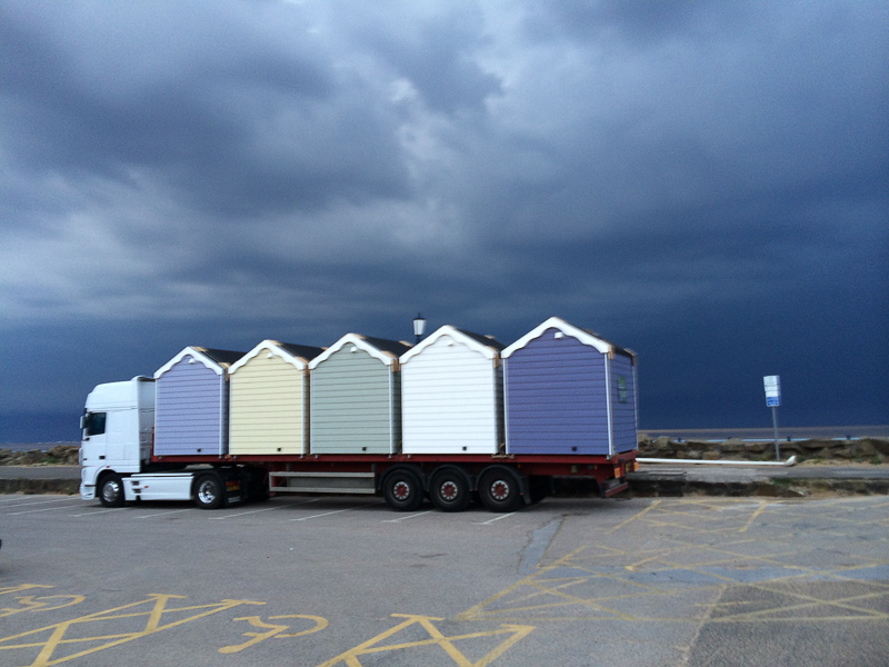 New beach huts arriving on a delivery lorry